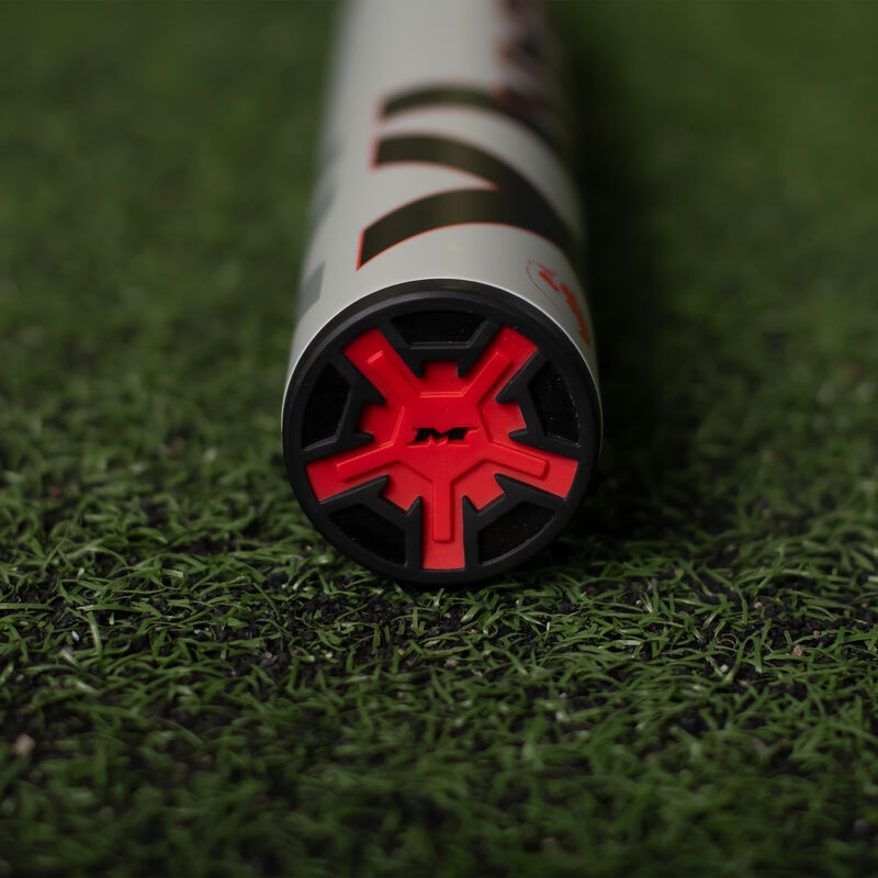 Red end cap of a Miken Josh Riley Supermax bat laying on turf - SKU: MSU3JRX