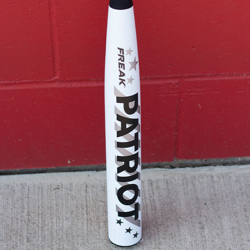 White barrel of a Freak Patriot bat in front of a red wall - SKU: MSA3FPL