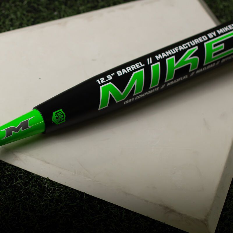 A black/green Miken Freak Lucky Maxload USA bat on home plate - SKU: MSA3FLKL loading=
