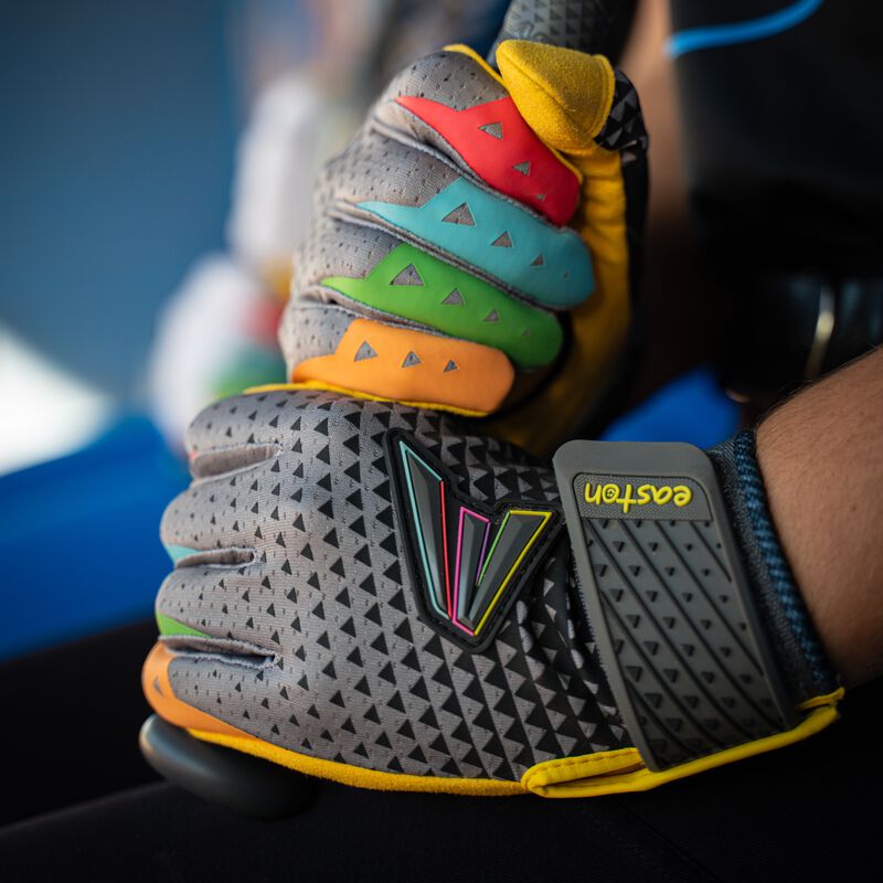 Picture of two hands wearing black Easton x Happiness Project Ghost NX fastpitch batting gloves holding a bat loading=