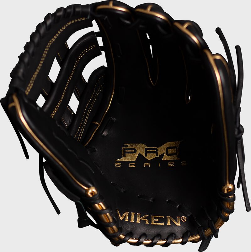 Palm of a black Miken Pro Series Freak Gold glove with gold stamping - SKU: PRO140-BG loading=