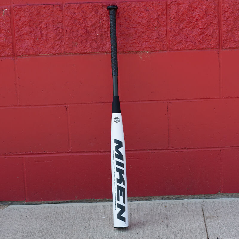 A white/black Freak Patriot USA slowpitch bat in front of a red wall - SKU: MSA3FPL
