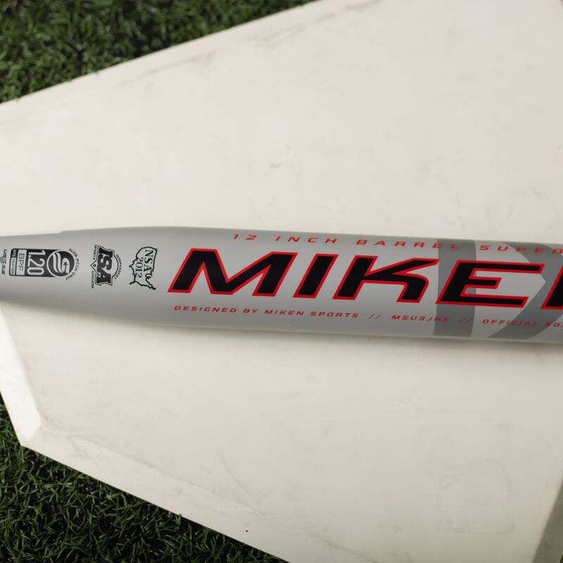 Miken logo on the barrel of a Josh Riley USSSA Bat on homeplate - SKU: MSU3JRX loading=